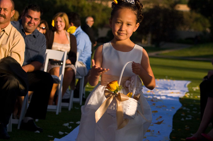 Stop motion image of flowers in the air being thrown by Flower girl